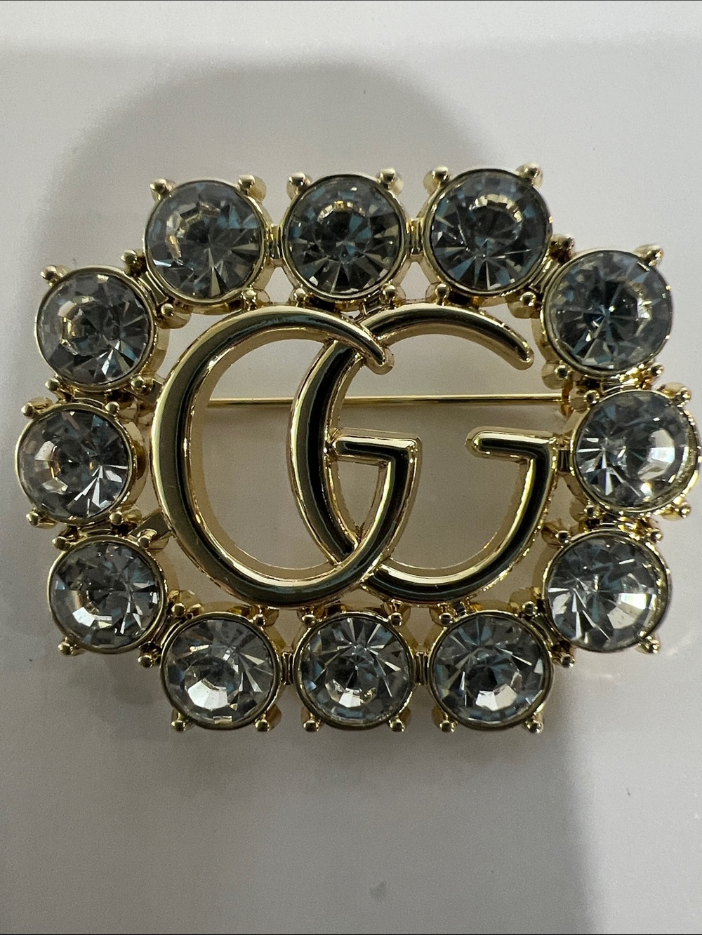 Gucci Gold GG Crystal Circle Brooch with Clear Stones